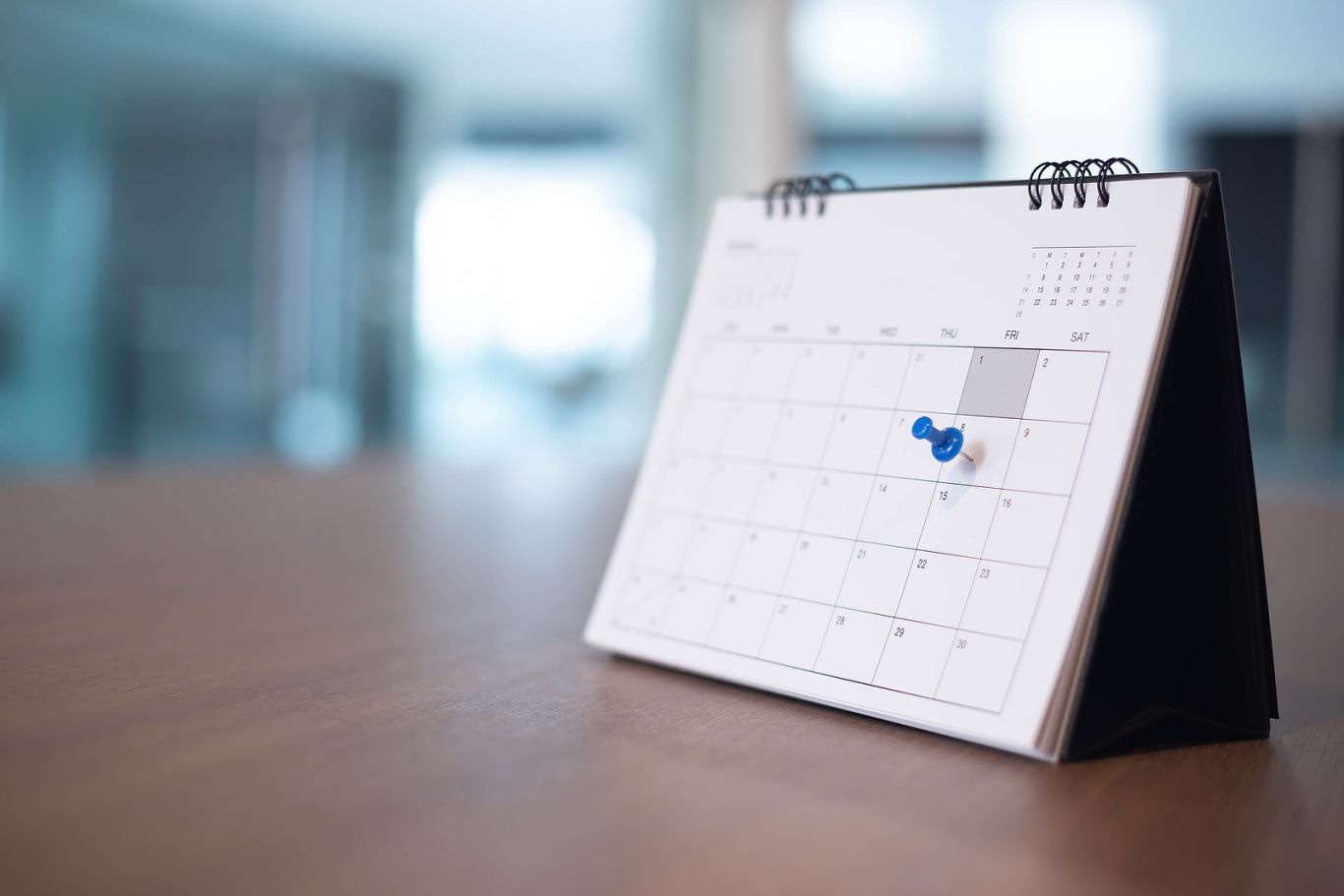 A desk calendar with a date pinned