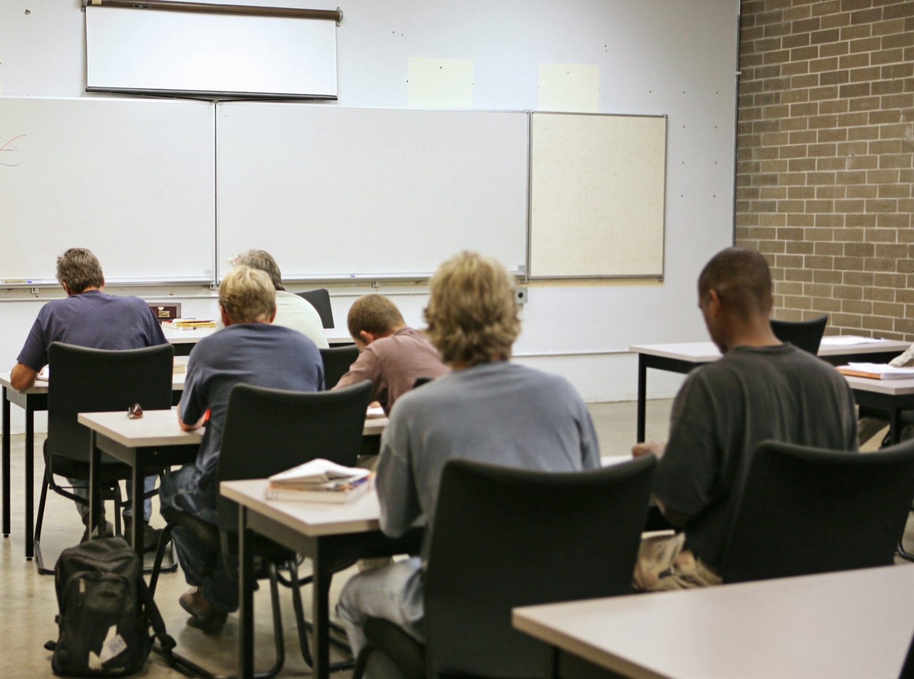 Adult students seated in a training classroom